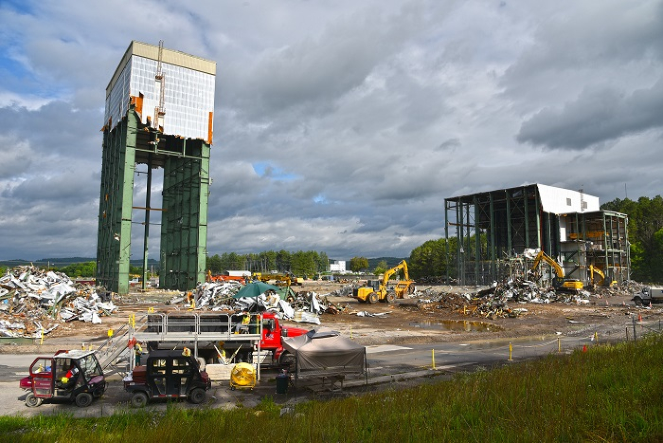 A view of the last remaining portions of Oak Ridge’s once sprawling Centrifuge Complex are shown here before crews pulled down the 180-foot tower, at left. Workers will now focus on removing the debris and finalizing demolition on the K-1210 complex, at r