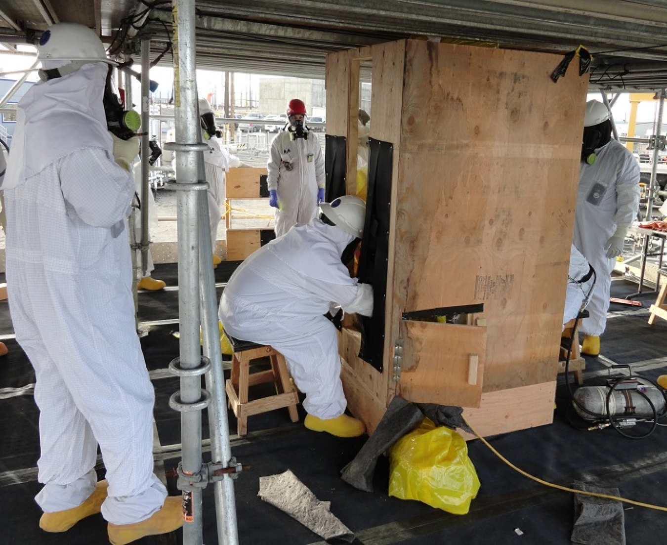 Washington River Protection Solutions workers use shielding to remove a highly contaminated thermocouple from a Hanford tank farm. Planning and mock-ups significantly reduced potential exposure risks while removing thermocouples.