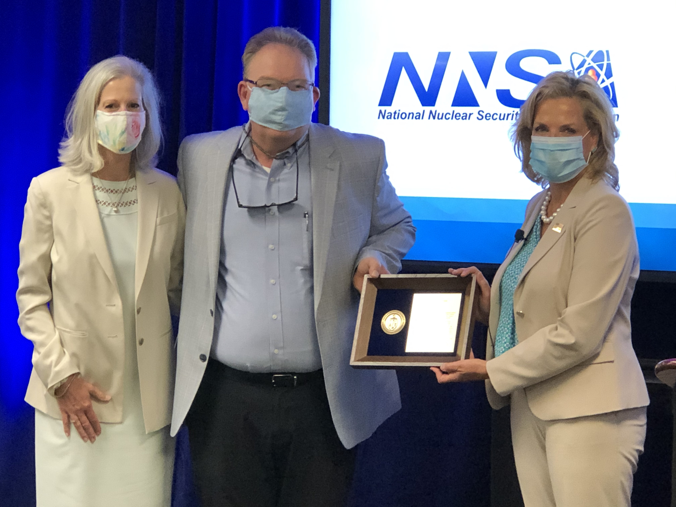 NNSA Administrator Lisa E. Gordon-Hagerty, right, presents Scott Cannon with the Department of Energy's Federal Project Manager of the Year for 2019 award. He was accompanied by his wife Nora Cannon.