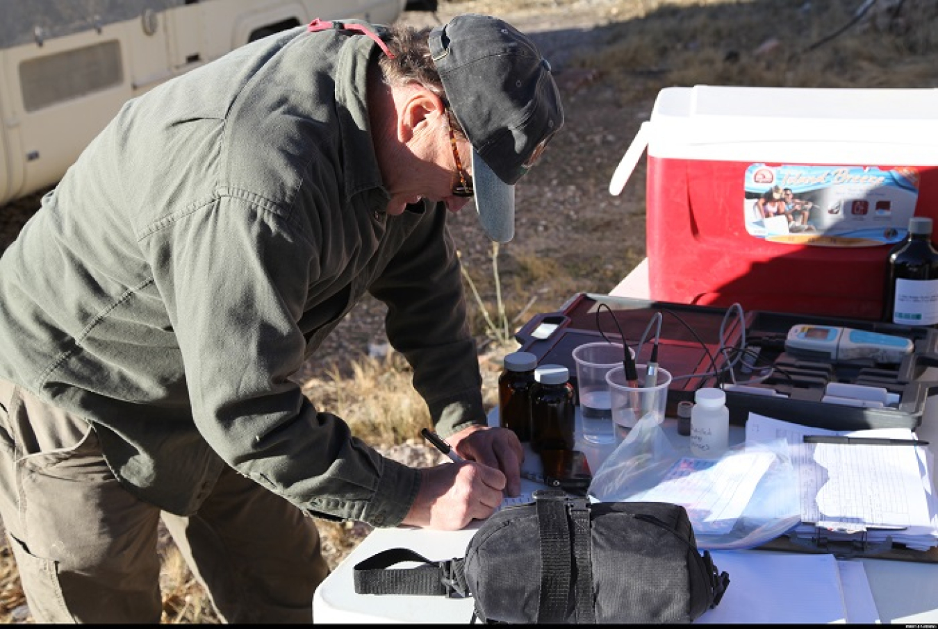 Nye County’s John Klenke collects water samples from an Amargosa Valley location.