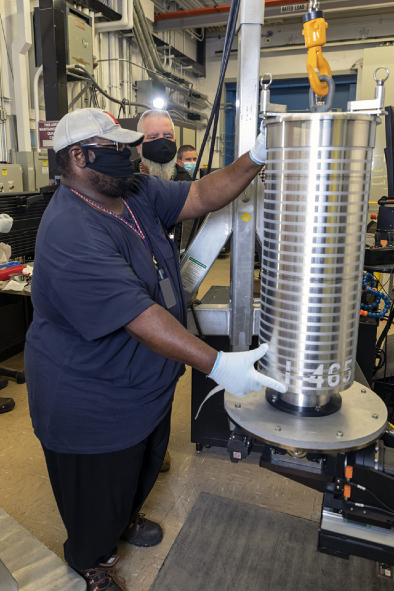 Y-12 National Security Complex Material Clerk Kenny Blakely positions an inner fuel element so it can be secured for computed tomography scanning.