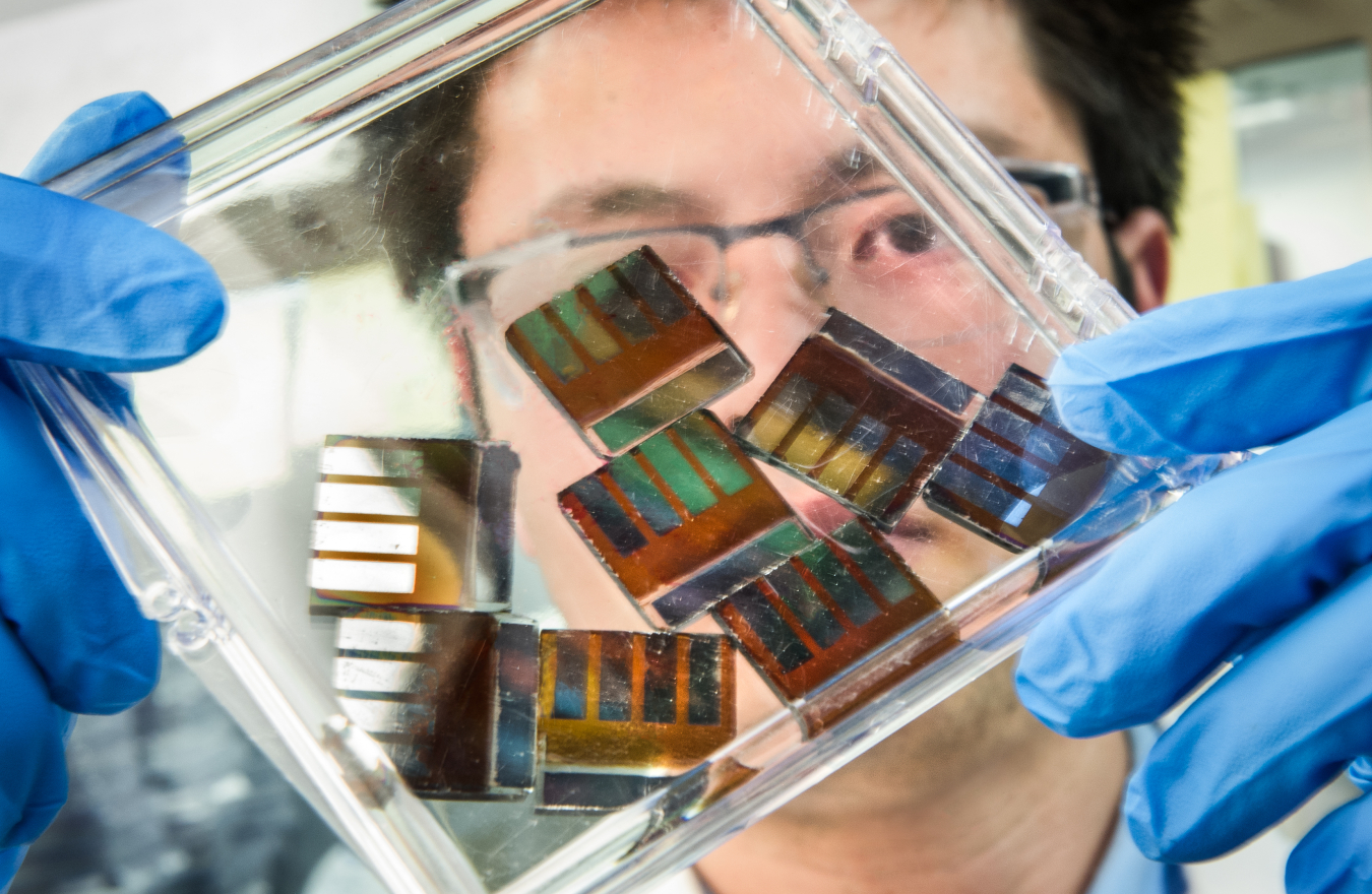 NREL researcher, Mengjin Yang, works with hybrid perovskite solar cells in his lab at the National Renewable Energy Laboratory (NREL). 