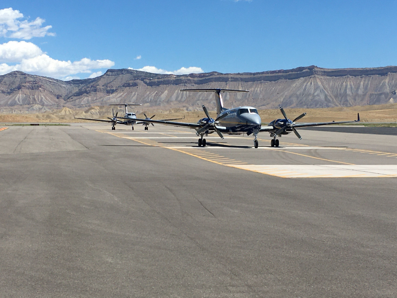 NNSA aircraft taxi to the portion of the Grand Junction runway dedicated to calibration pads.