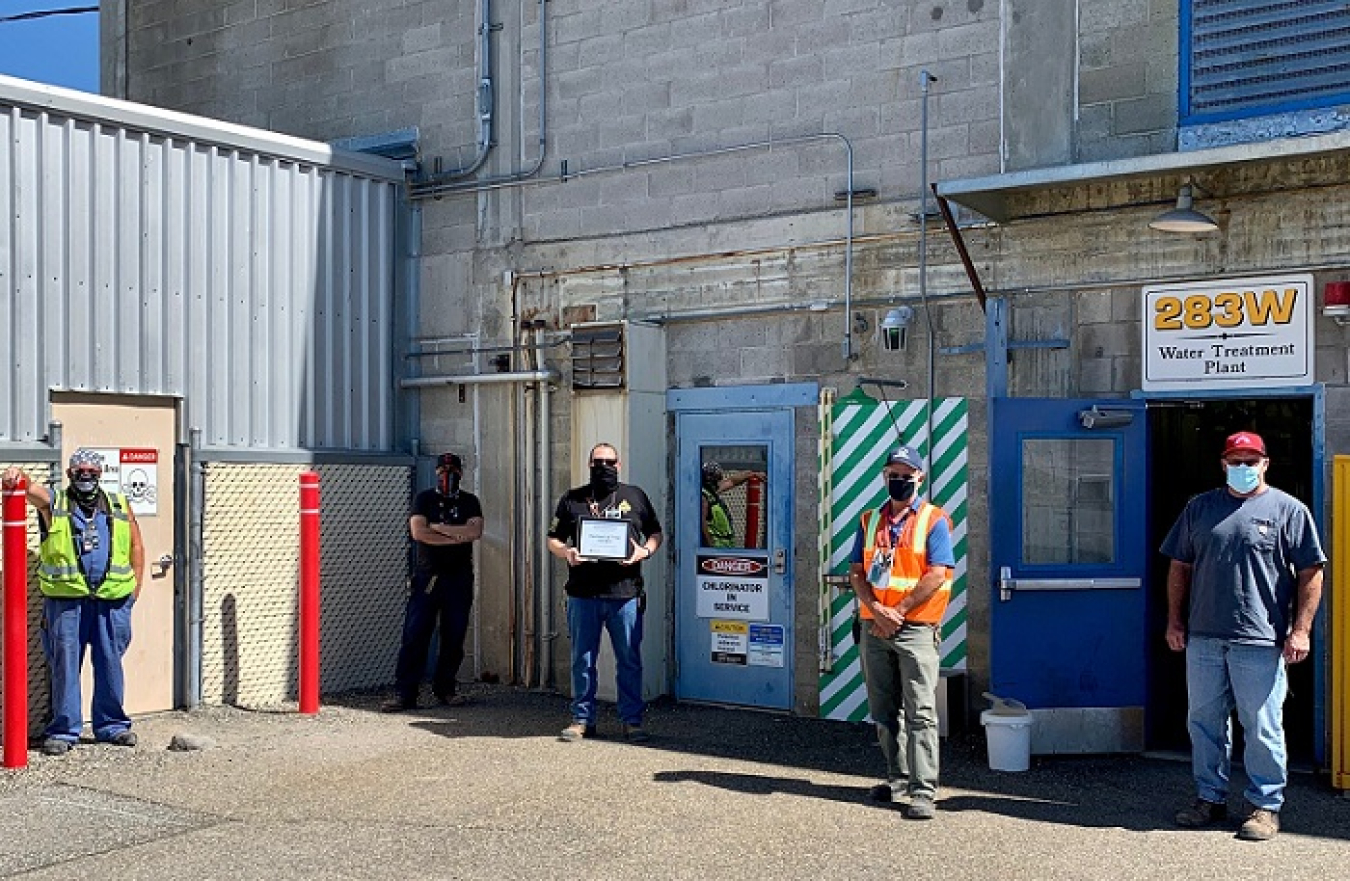 Employees for the Hanford Site’s 283 West Water Treatment Plant — from left, Vinni Dragoo, Richard Herrera, Ed Lerma, Burke Neuman, and Bob Ward — display the Silver Certificate of Achievement presented by the Washington State Department of Health. 