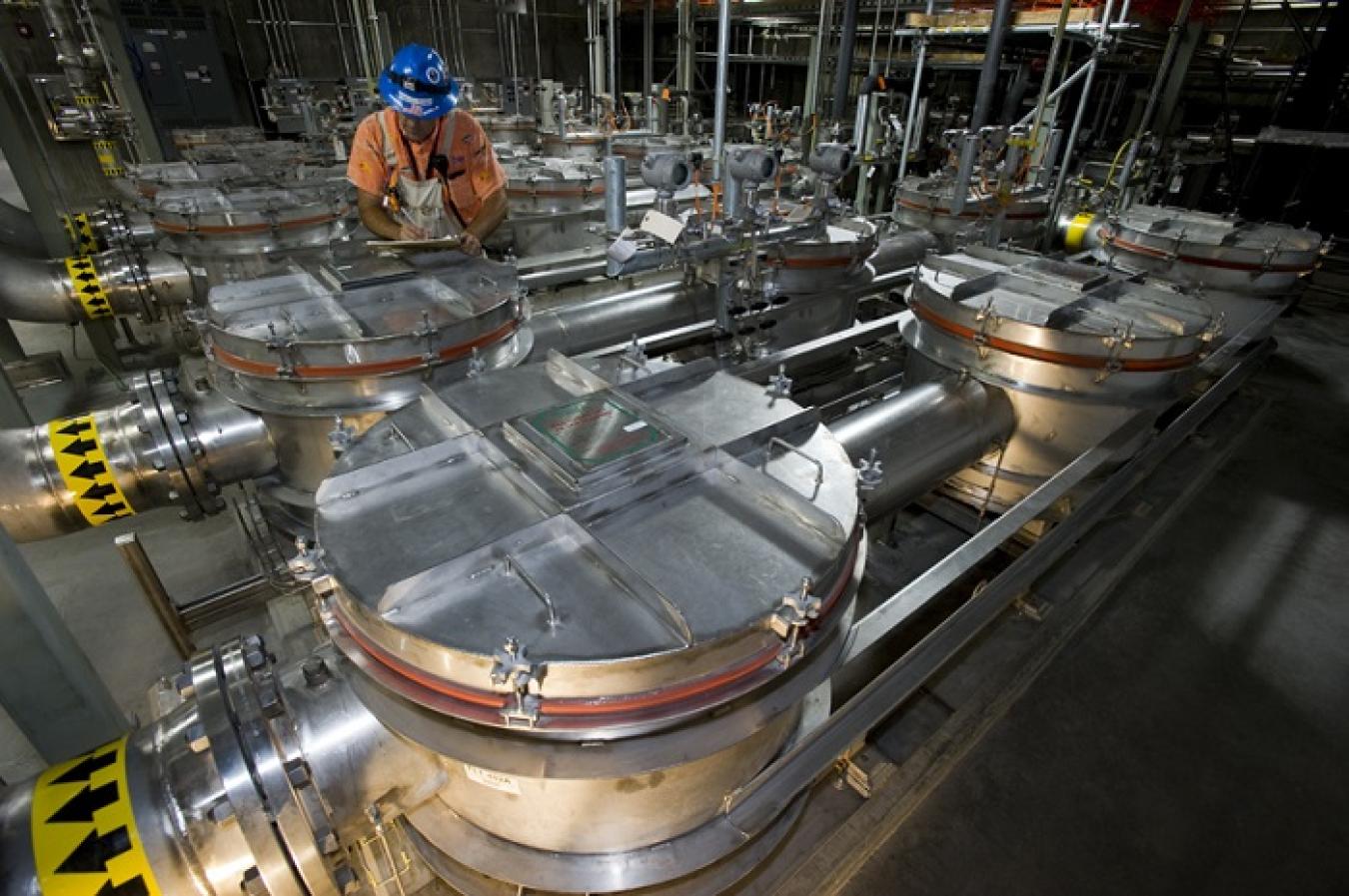 An employee checks filter operations in the laboratory vent room at the Salt Waste Processing Facility.