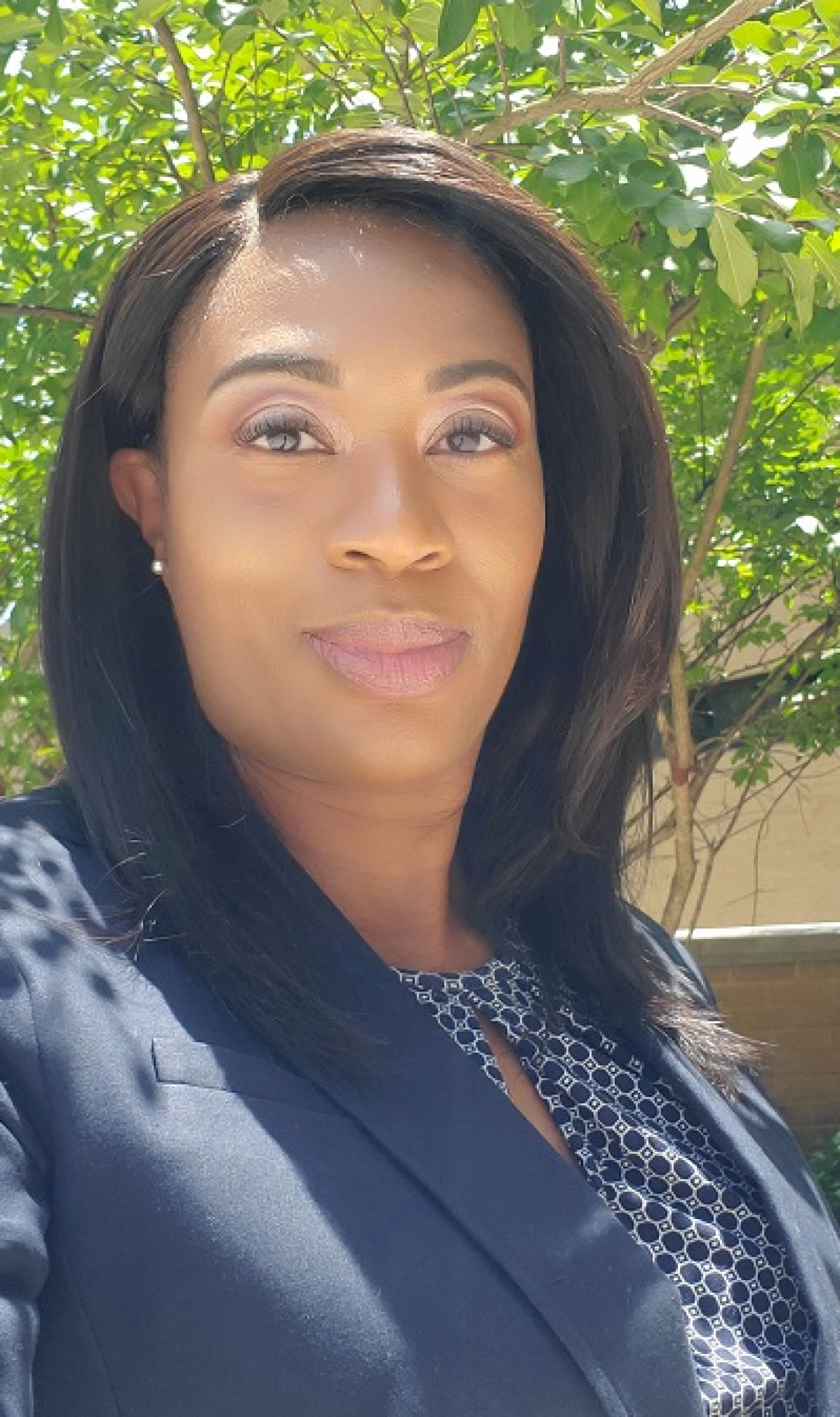 Headshot of Fredericka Brown in an outdoor setting.