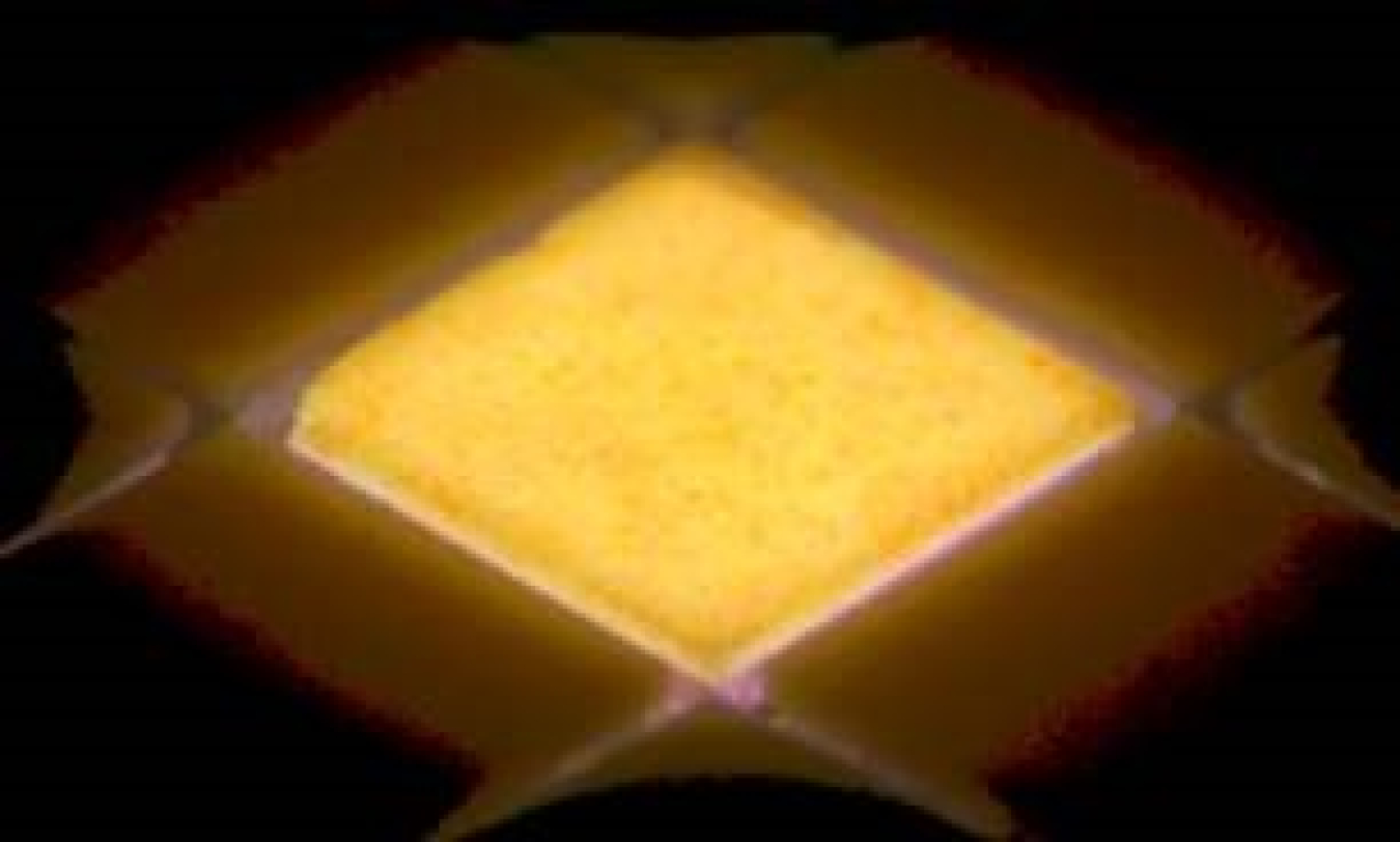 Prototype high-luminance LEDs in dense array, with center LED lit up.