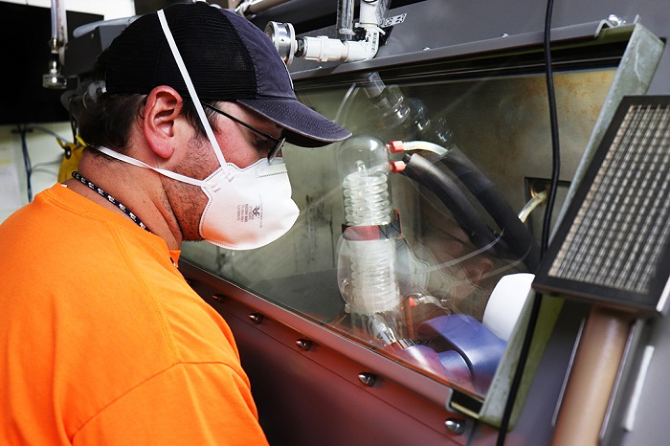 Employees, known as fissile material handlers, use shielded gloveboxes to dissolve uranium (U)-233 into a low-level form so it can be mixed with grout for safe transportation and disposal. 