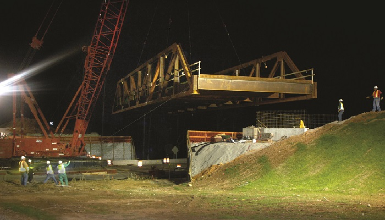 A view of workers constructing Haul Road, which has allowed the Oak Ridge Office of Environmental Management to avoid using local public highways to transport tens of thousands of truckloads of waste for disposal.