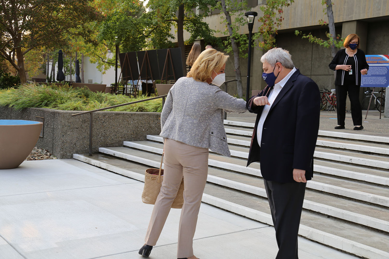 Keeping with COVID-19 protocols, NNSA Administrator Lisa E. Gordon-Hagerty elbow-bumps Lawrence Livermore National Laboratory Director Dr. Bill Goldstein during her visit to the Lab.