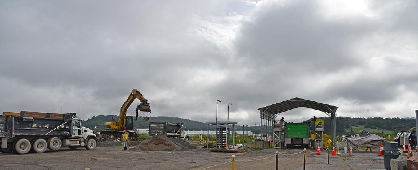 Crews haul away debris from Oak Ridge's K-1600 demolition project, marking the last of demolition activities at the former Oak Ridge Gaseous Diffusion Plant.