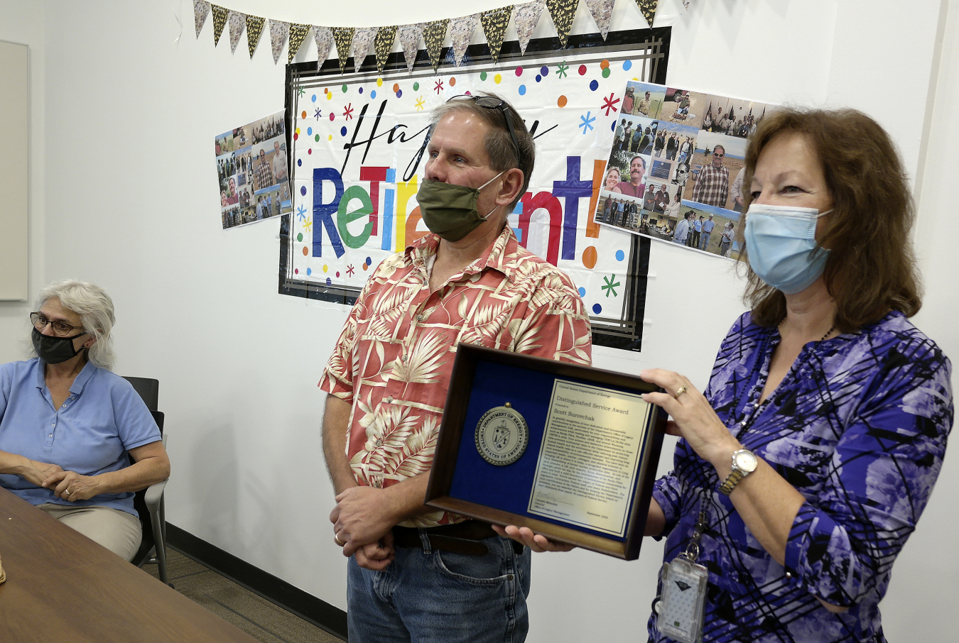 Environmental Team Supervisor Gwen Hooten presents Scott with a DOE Distinguished Service Award on Sept. 30, 2020.