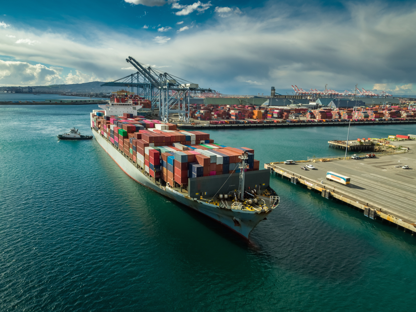 Aerial shot of a cargo ship arriving in the Port of Long Beach, California