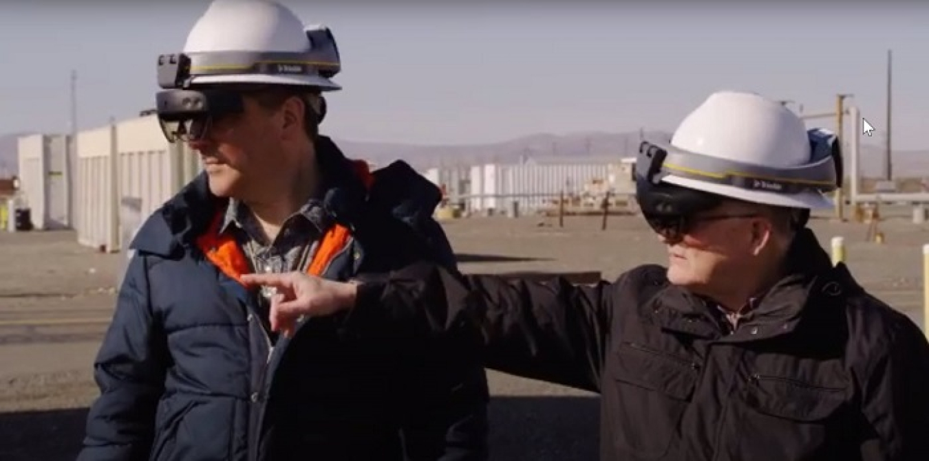 Doug Fenske, left, and Byron Gessel, team members with EM Richland Operations Office contractor Mission Support Alliance, demonstrate the use of location intelligence and mixed reality to locate underground utilities.