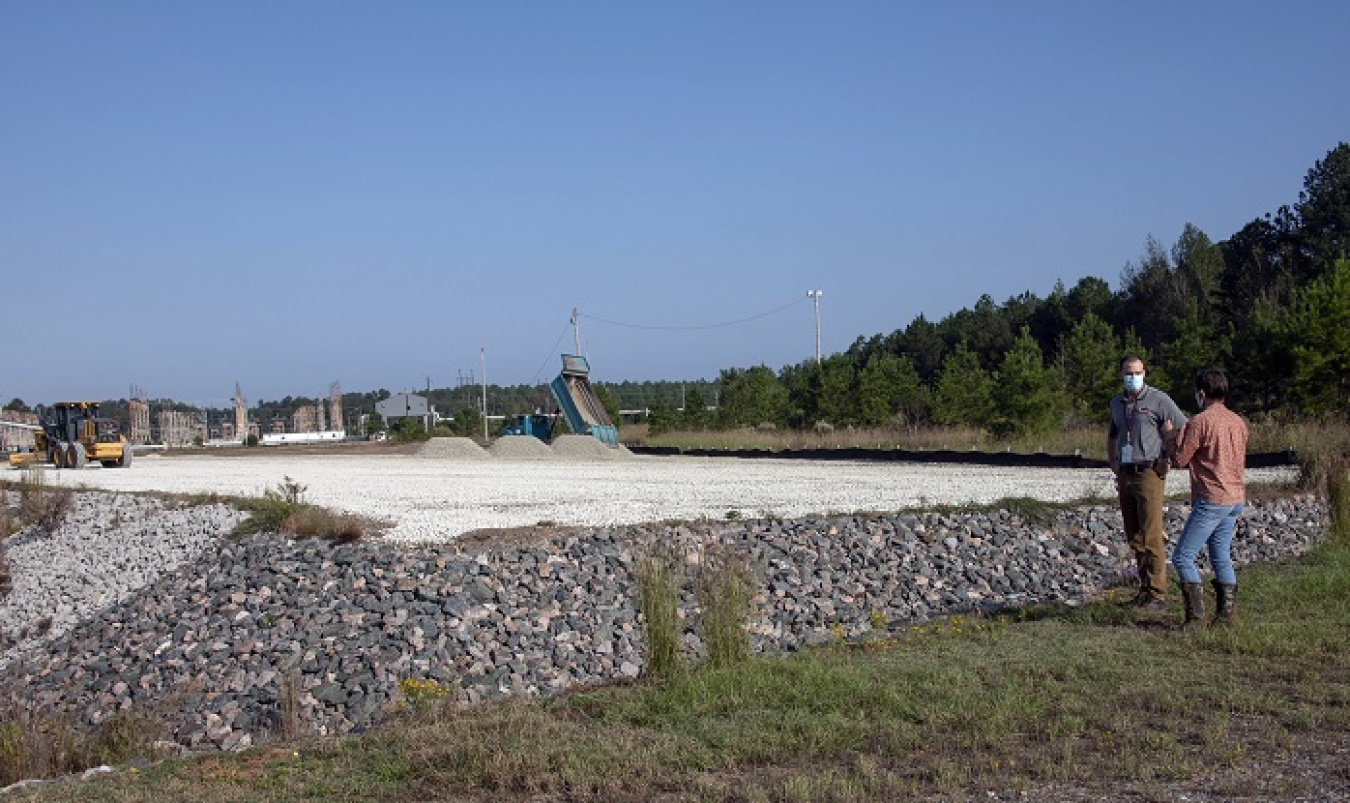 Savannah River Nuclear Solutions project manager Kelsey Holcomb discusses the cleanup of the D-Area Coal Storage Yard with DOE-Savannah River Federal Project Director Karen Adams at the project site.