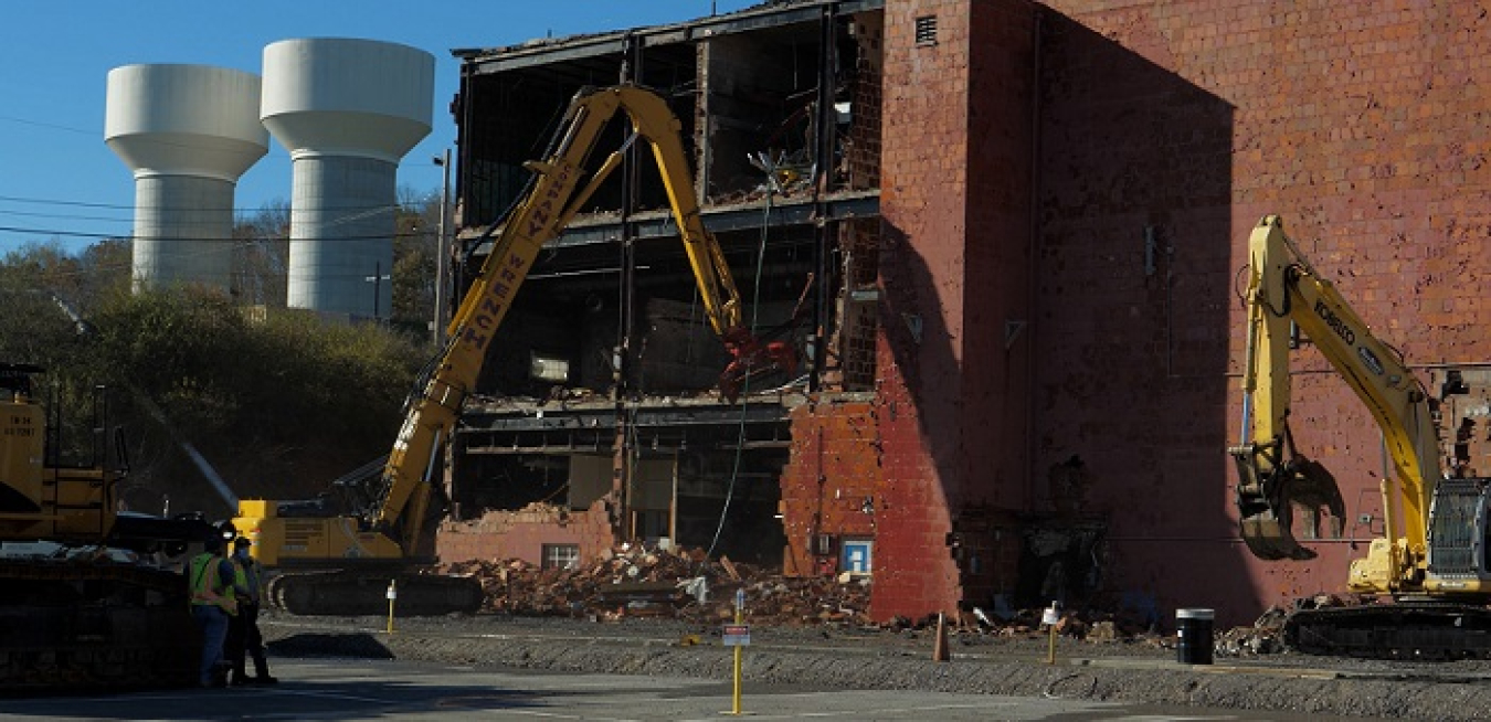 EM crews begin knocking down the three-story 65,000-square-foot Building 9210 at Oak Ridge on Nov. 16.