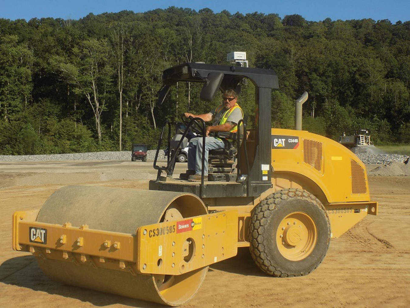 A MyZone Technologies Worker Alert Systems transmitter is affixed to the top of a piece of equipment as work is performed in the field.