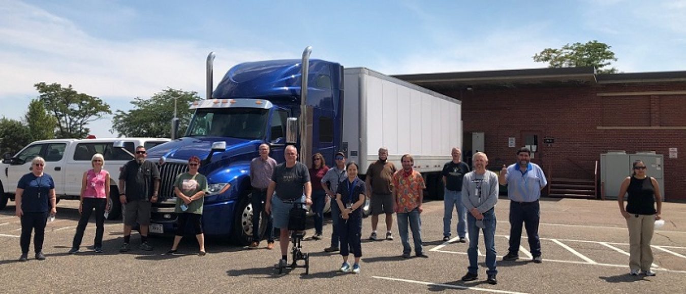 Team members at the Denver Federal Center are shown after loading archive material for secure transport to Los Alamos National Laboratory in August.