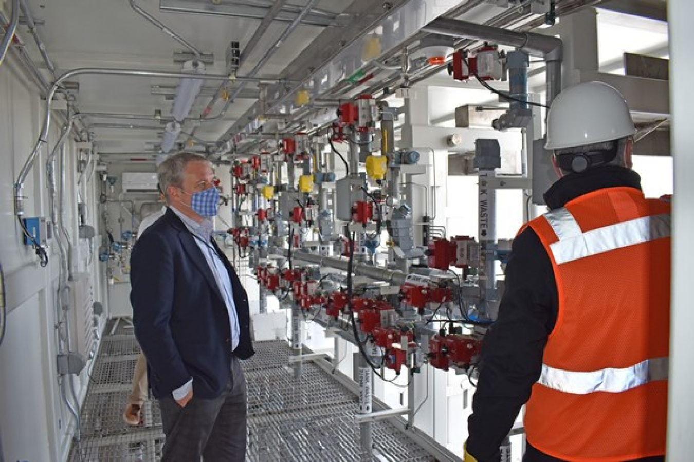 During a visit to the Hanford Site last week, EM Senior Advisor William “Ike” White, left, got a look inside enclosures for the pretreatment system that will prepare waste from Hanford’s large underground tanks.