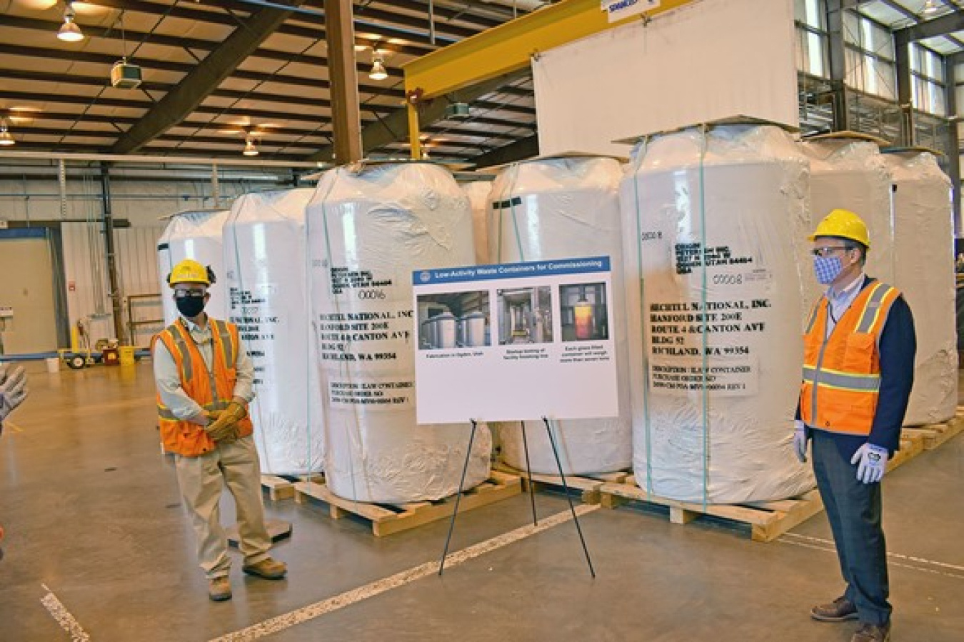 EM Senior Advisor William “Ike” White, right, stopped by the Waste Treatment and Immobilization Plant during a visit to the Hanford Site last week and saw the first 20 containers that will hold waste simulant and tank waste that is vitrified.