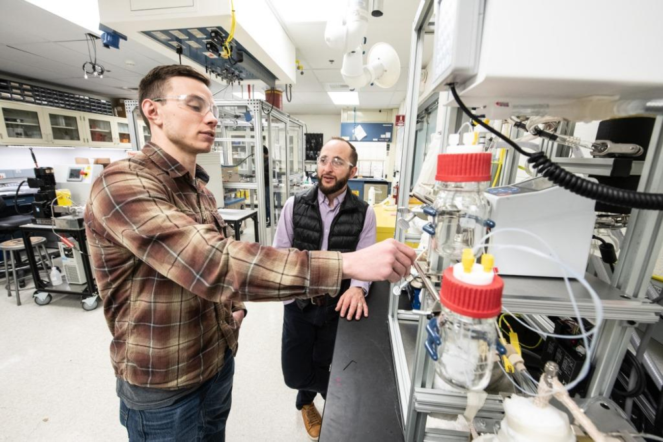 NREL researchers Joseph Roback (left) and Nolan Wilson (right) study separation approaches to isolate purified chemical products using scalable and cost-effective unit operations.
