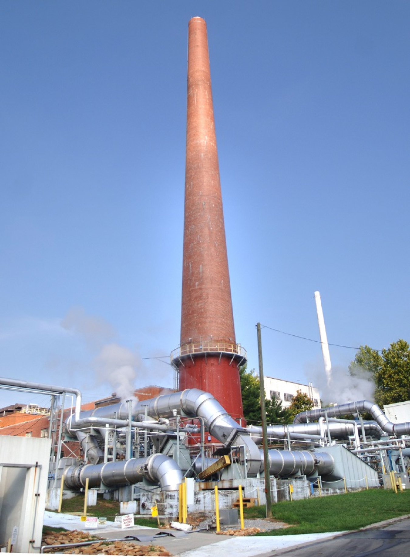 A view of the 3039 exhaust stack, which was built in 1950 and stands 250 feet tall. It provides high-efficiency particulate air (HEPA)-filtered ventilation exhaust for numerous radiological facilities.t