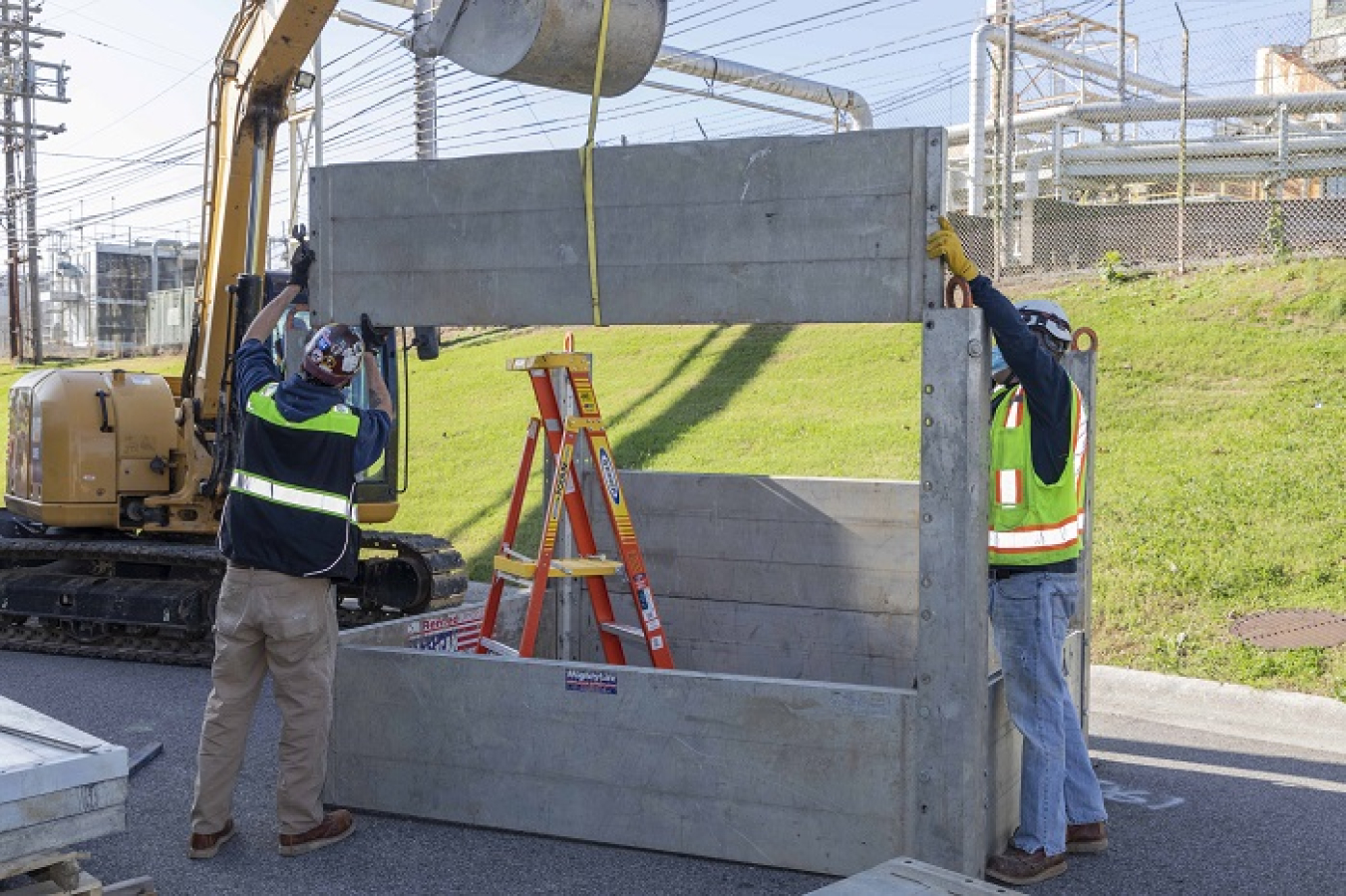 Workers dismantle transport platforms at the Y-12 National Security Complex so they can be taken to the Oak Ridge National Laboratory. The platforms will be installed to support deactivation activities at the eight-story Experimental Gas-Cooled Reactor.