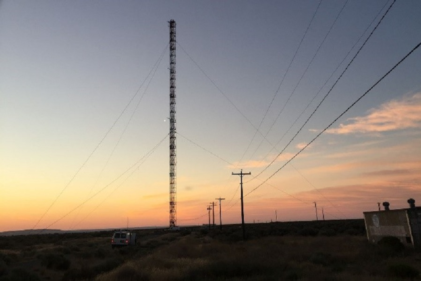 The sun begins to rise behind the 400-foot Hanford Meteorological Station tower, a source of current and historical weather data for the Hanford Site since 1944.