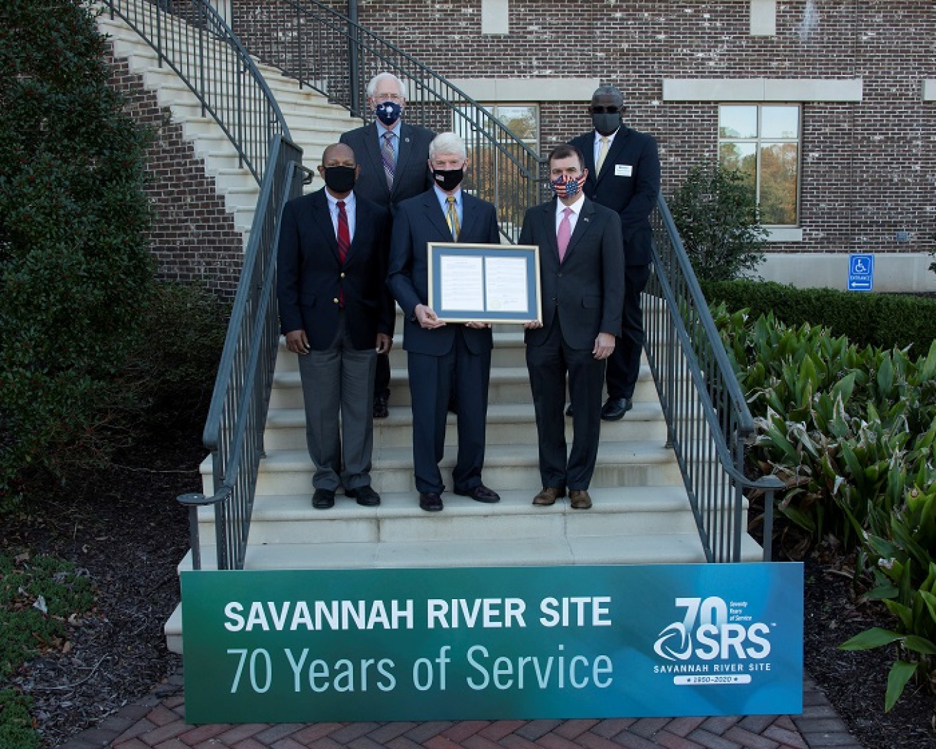 State Sen. Tom Young and State Rep. Bill Taylor bestow a Senate resolution designating Savannah River Site Day in South Carolina on Nov. 28, 2020.