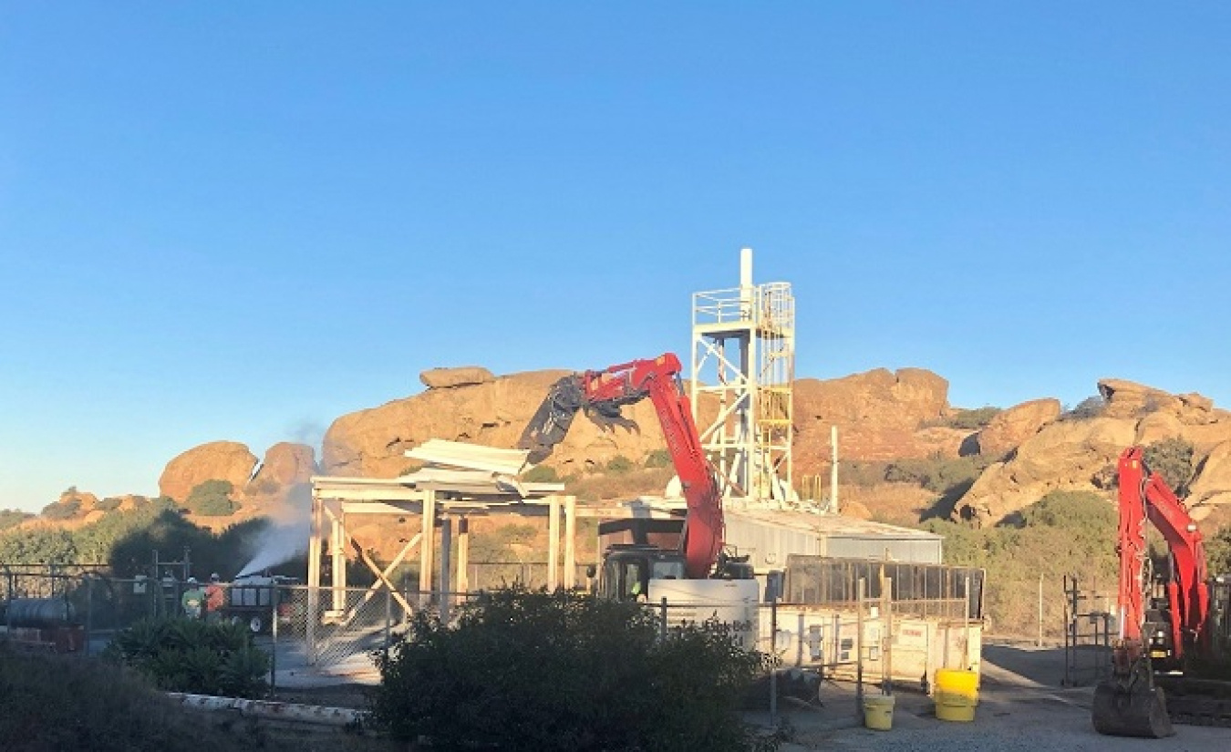 EM crews use shears to remove an ancillary structure at the former Energy Technology Engineering Center site.