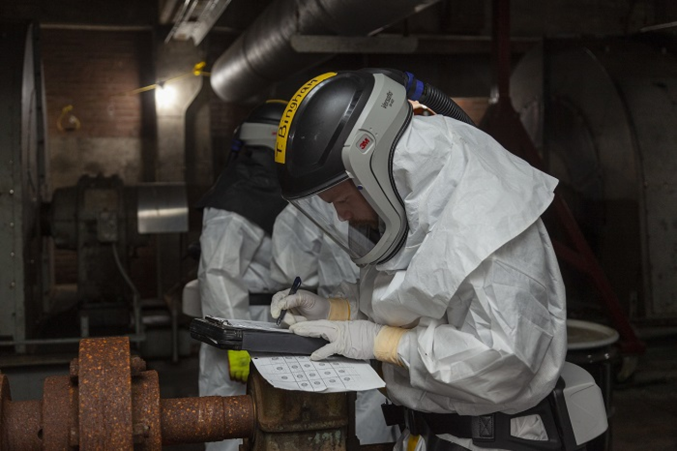 EM crews have transitioned from the successful completion of core cleanup at the East Tennessee Technology Park to projects at the Oak Ridge National Laboratory and Y-12 National Security Complex. Pictured are workers performing deactivation activities inside Manhattan Project-era facilities at Y-12.