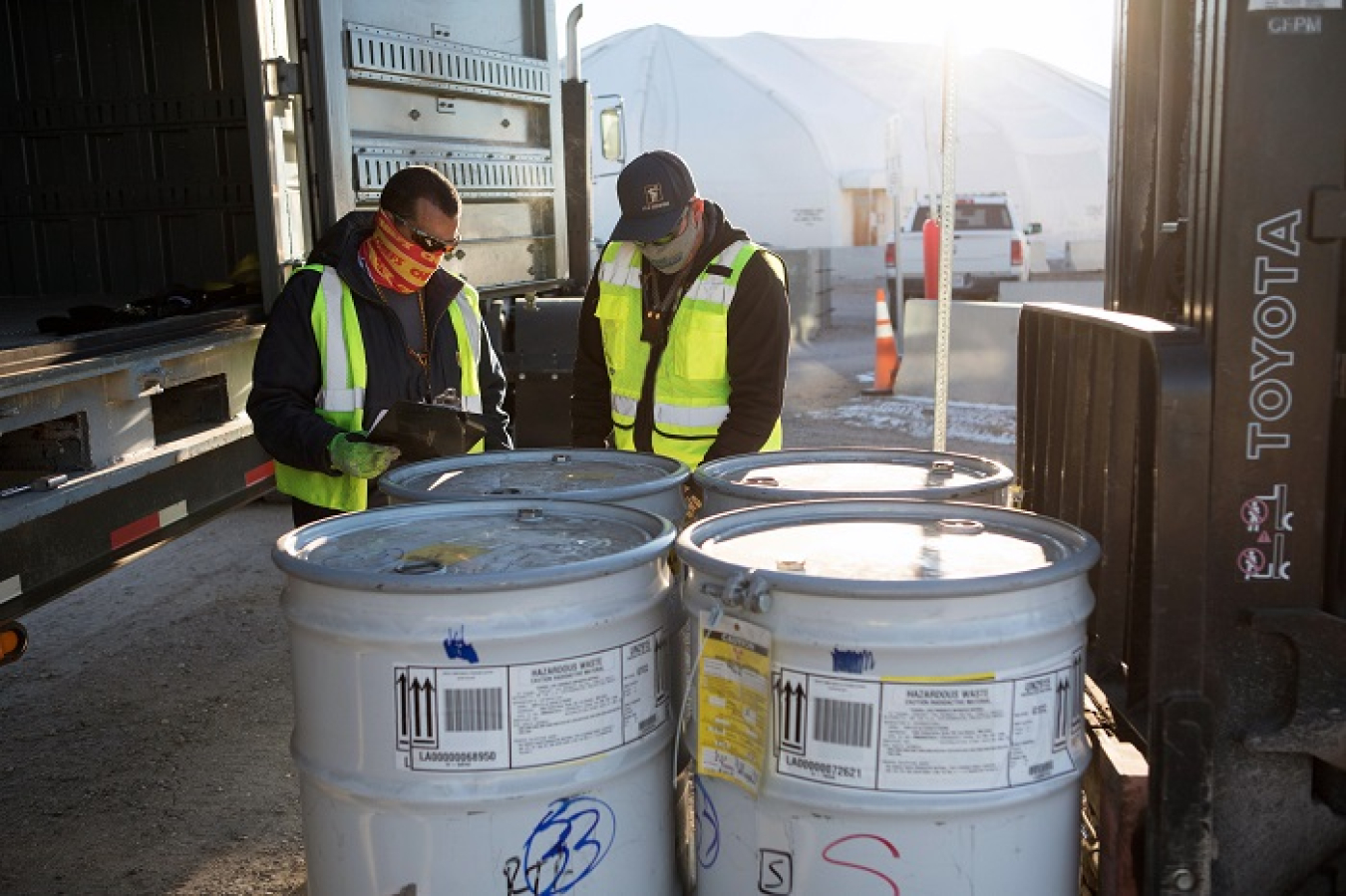 N3B employees prepare transuranic waste drums at Area G for transportation to the Los Alamos National Laboratory's Radioassay and Nondestructive Testing facility.