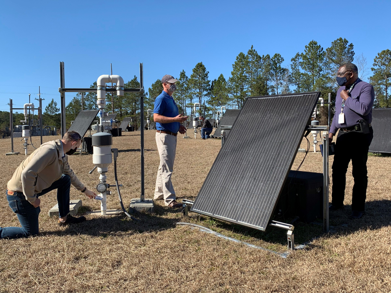 Savannah River Nuclear Solutions engineers discuss a plan to move equipment used to close 19 soil cleanup sites to a storage location. In time, the equipment will be reused at other environmental remediation projects across the Savannah River Site. Shown from left are Will Jolin, John Bradley, and Joao Cardoso-Neto.