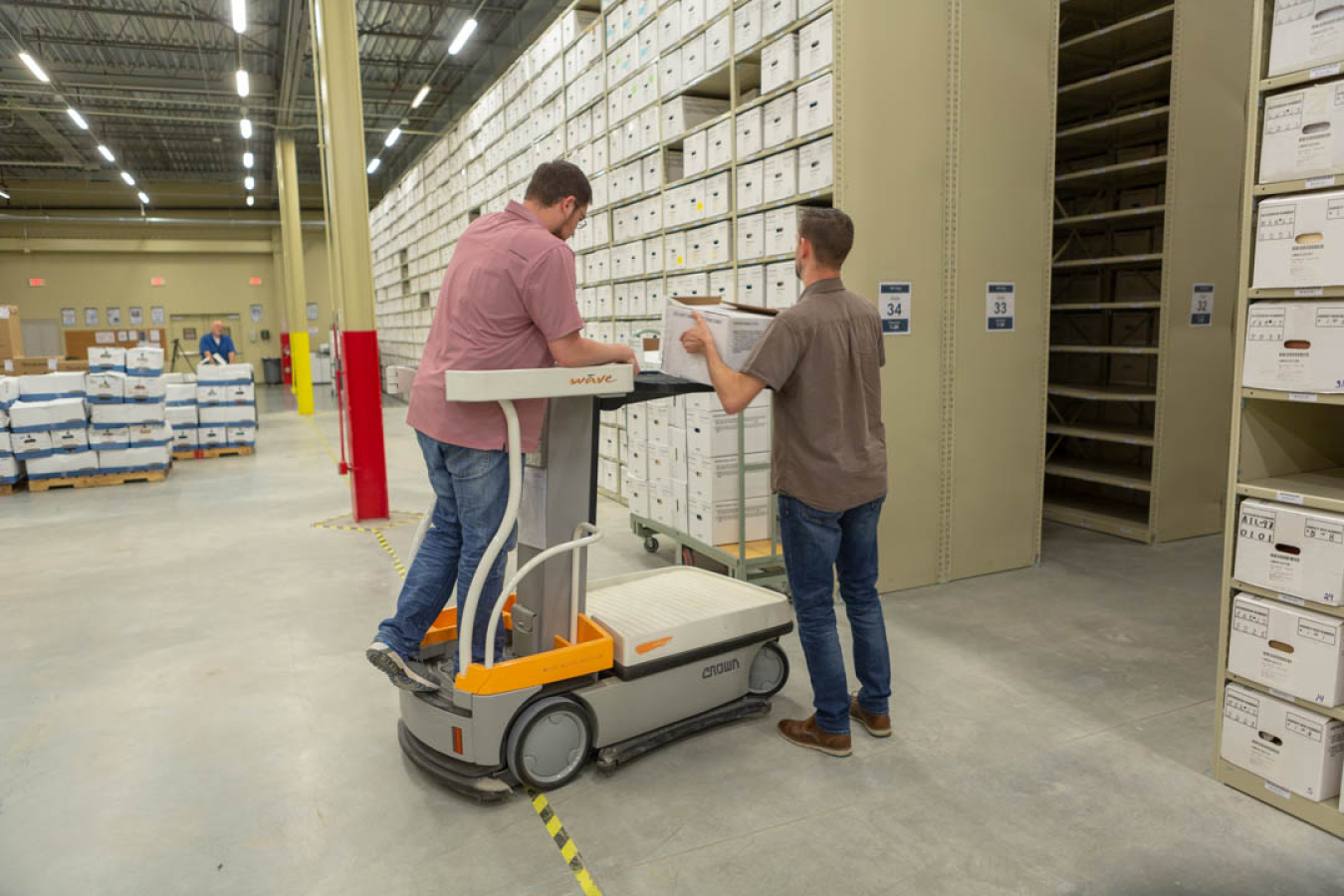 LM Strategic Partner staff shelve records materials.