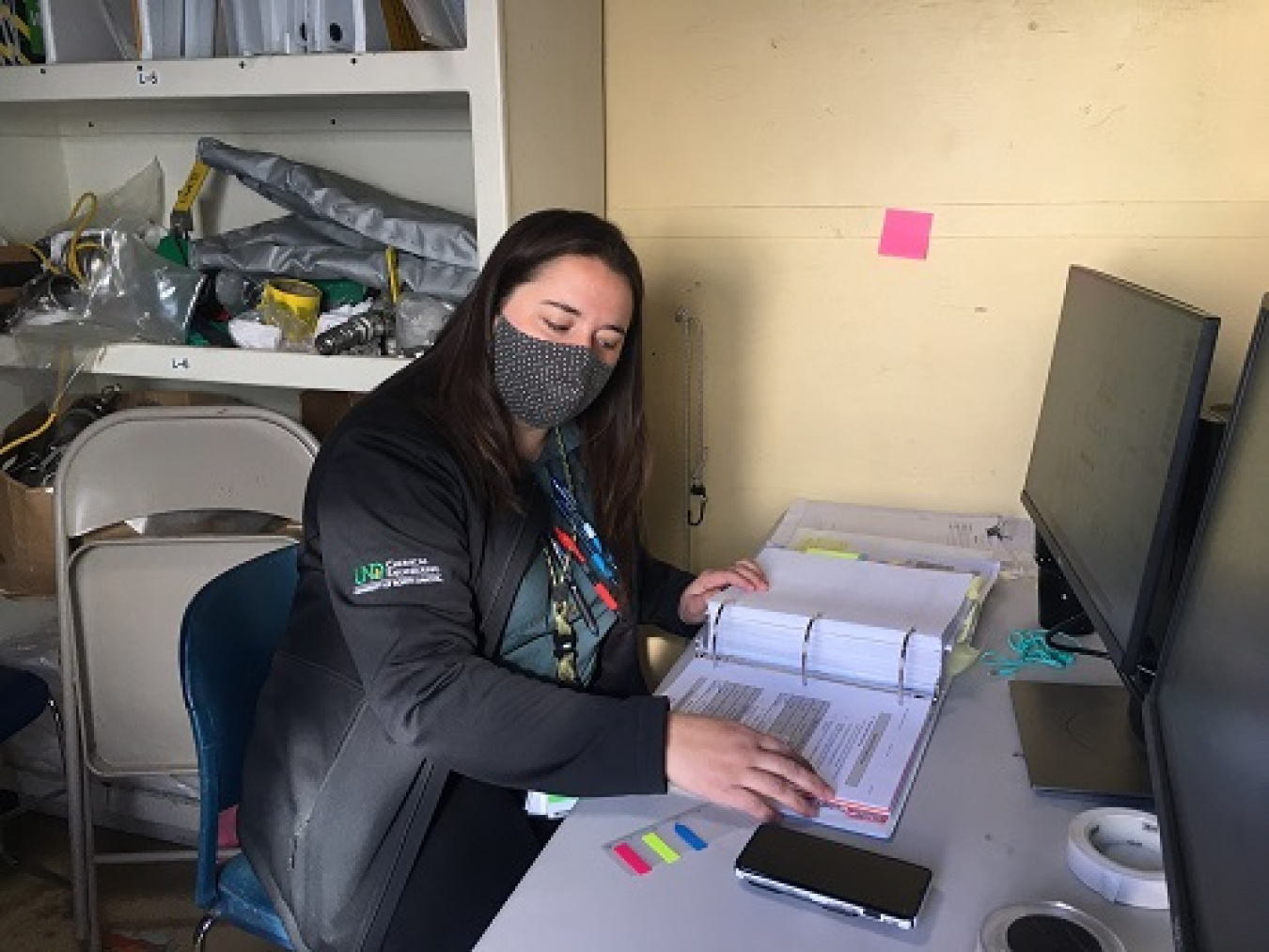 Washington River Protection Solutions Testing Director Tessa Alexander reviews processes and procedures as operators use water to simulate waste runs through the Tank-Side Cesium Removal system on the Hanford Site.
