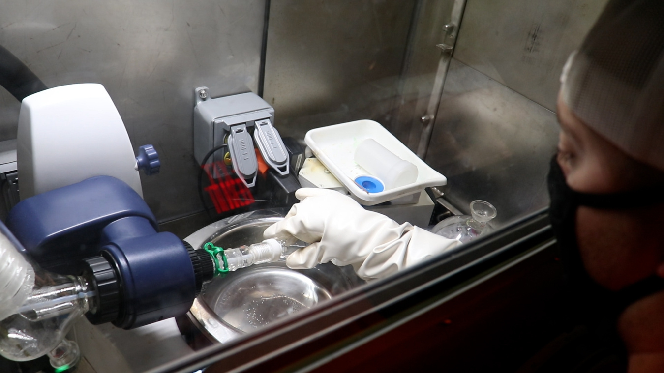 An operations technician removes a centrifuge tube of thorium-229 product at Oak Ridge. Under a newly expanded sales agreement, EM contractor Isotek will further refine the thorium to provide TerraPower an enhanced purified product to generate Actinium-225 for next-generation cancer research and treatment.