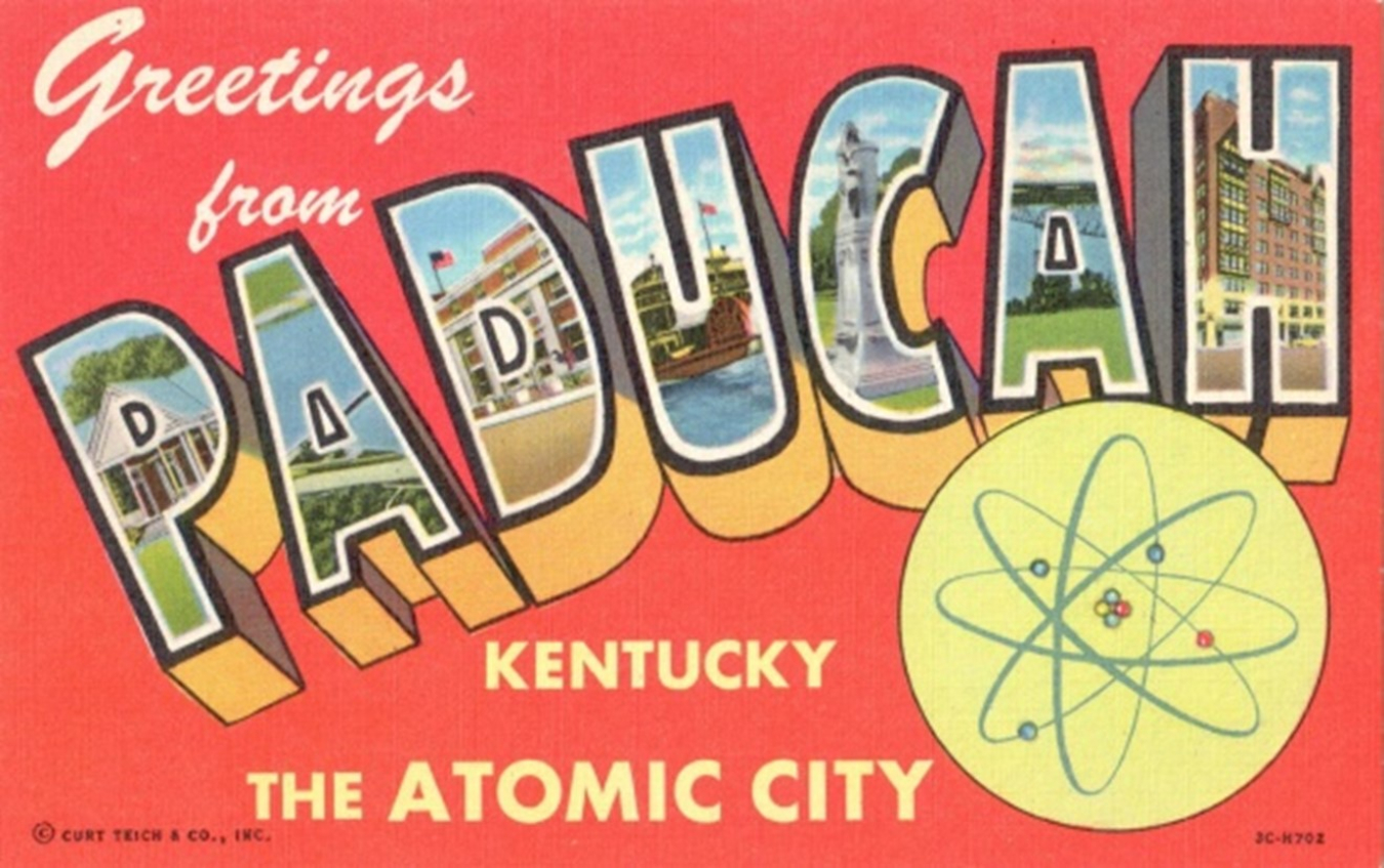 A postcard is shown from the uranium-enrichment era at Paducah, Kentucky. Although the postcard promoted the nearby City of Paducah, the Paducah Gaseous Diffusion Plant’s size and scope — akin to that of a small city — were commensurate with its impact on the region’s economy. The Paducah Site once used as much electricity as a city the size of Nashville, Tennessee.