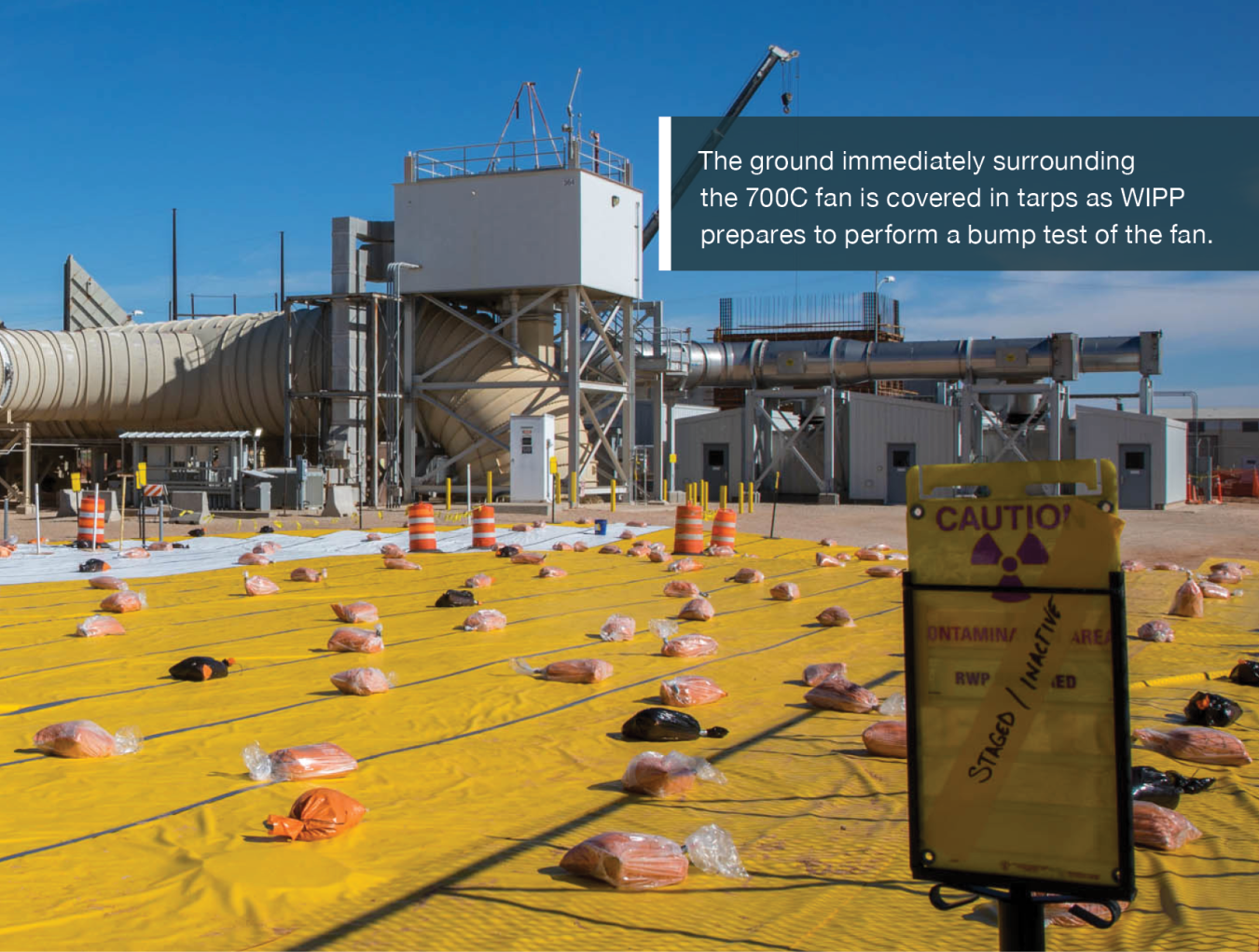 The ground immediately surrounding the 700C fan is covered in tarps as WIPP prepares to perform a bump test of the fan.
