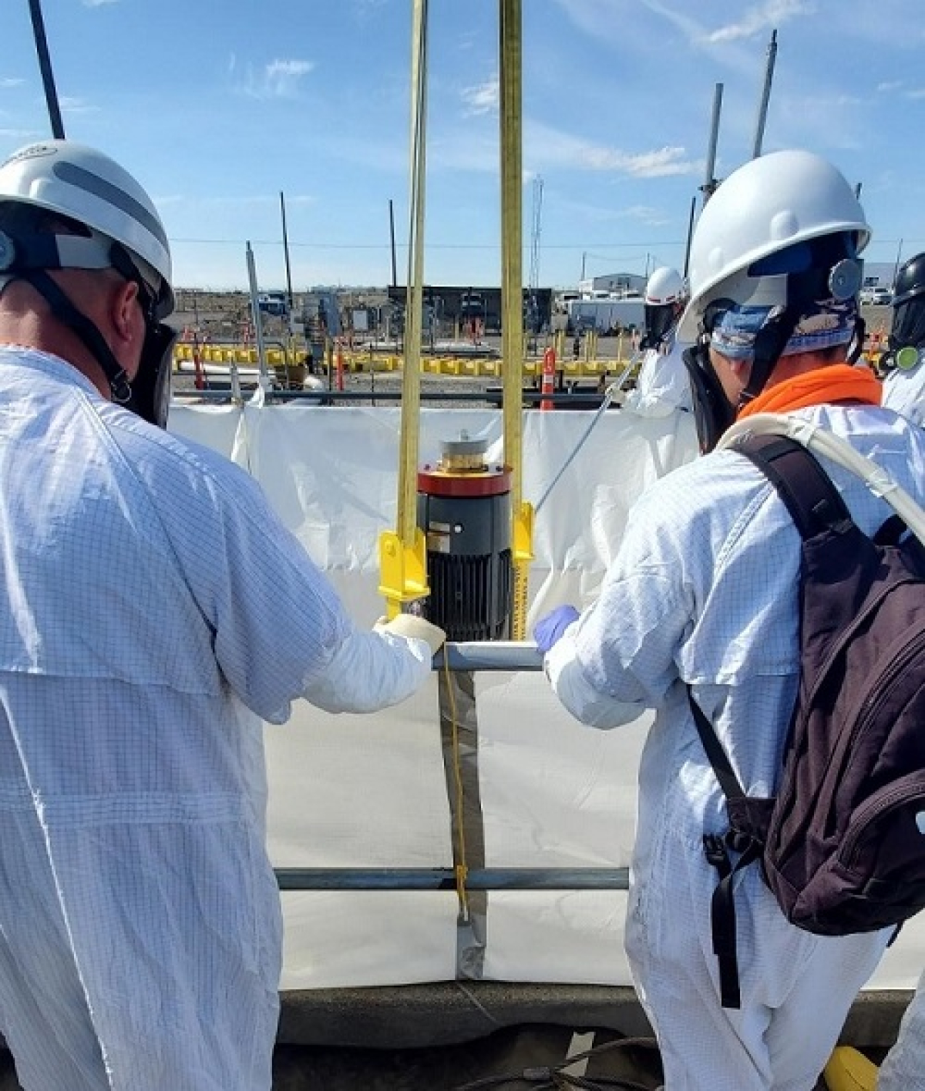 Washington River Protection Solutions employees install a pair of pumps into tank AP-106, which will feed waste treated by a Tank-Side Cesium Removal system to the Waste Treatment and Immobilization Plant.