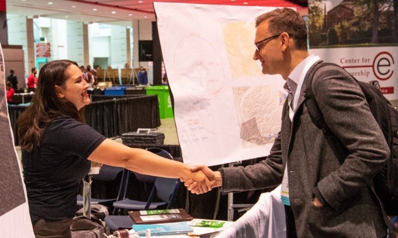Members of the wind industry shake hands.