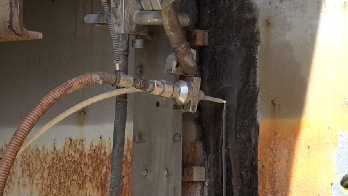 UCOR used an innovative technology to cut an opening through the thick carbon-steel outer shell of the Experimental Gas-Cooled Reactor. The system uses a waterjet process with a garnet-based abrasive. This method avoided hazards associated with torch cutting, and it was less labor intensive than using standard hand tools.