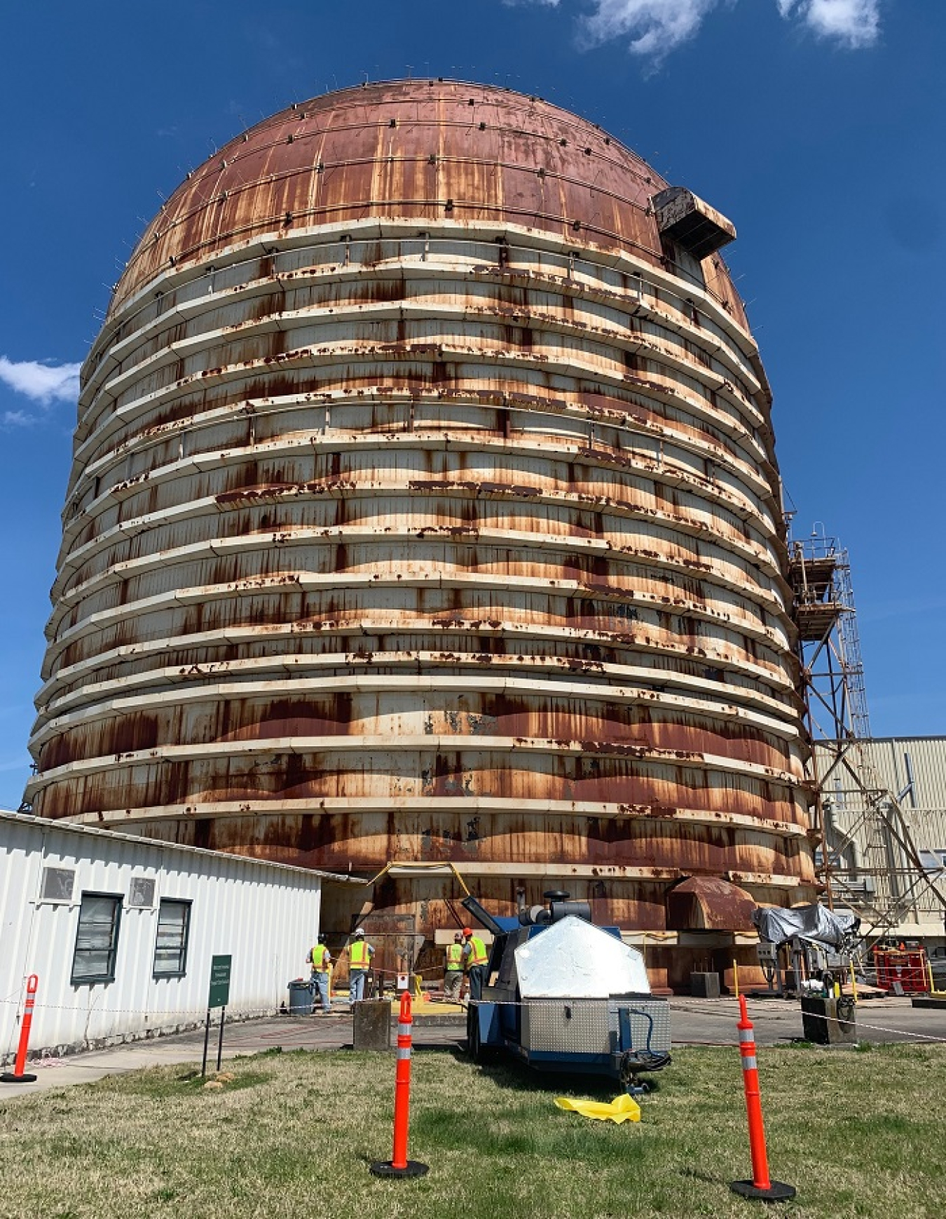 Crews prepare the Experimental Gas-Cooled Reactor for deactivation. The eight-story facility at the Oak Ridge National Laboratory stands 216 feet tall.