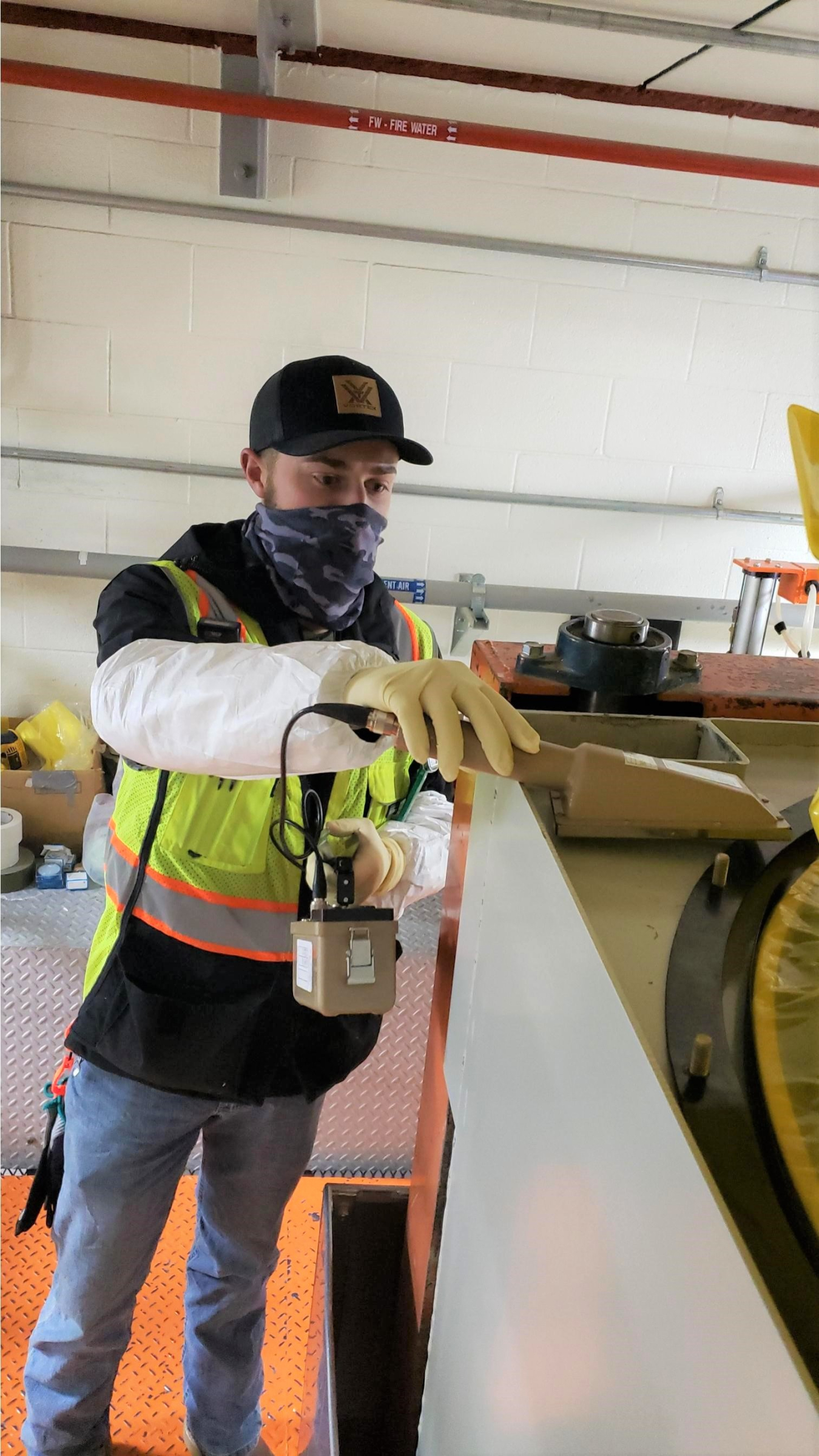 Ethan Hoopes, a radiation control technician for EM contractor Fluor Idaho, surveys a piece of equipment at the Advanced Mixed Waste Treatment Project at the Idaho National Laboratory Site.