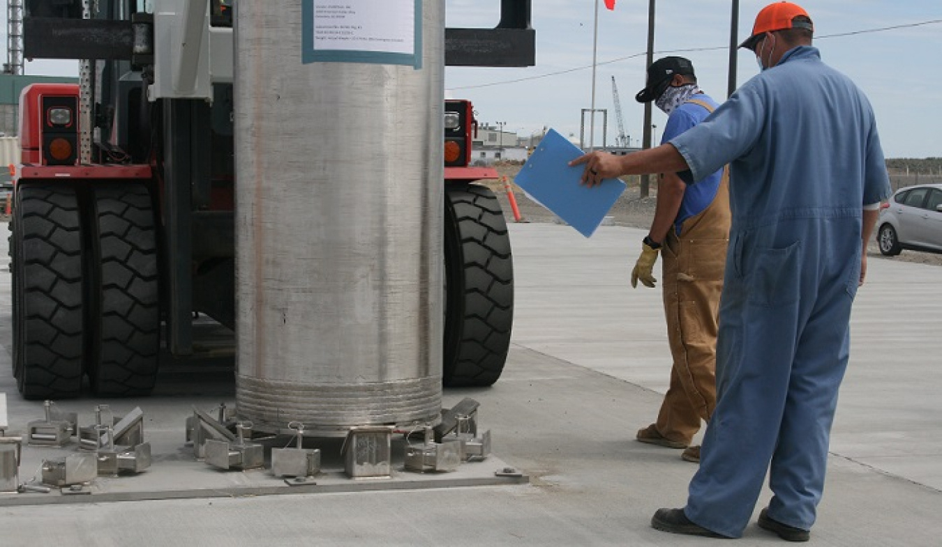 Crews with Washington River Protection Solutions place a mock-up ion-exchange column onto a storage pad during column replacement testing at the Hanford Site.