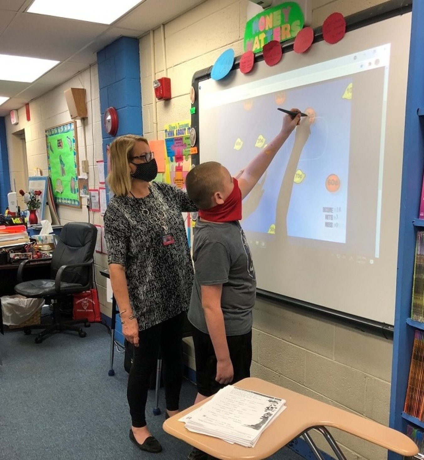 Sarah Maness, a teacher from Horace Maynard Middle School in Maynardville, Tennessee, is a 2021 UCOR grant recipient. Maness is shown introducing a student to a science, technology, engineering, and mathematics (STEM) project.