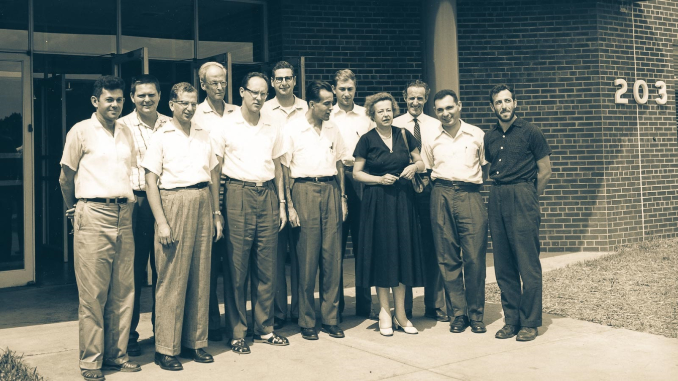 Maria Goeppert Mayer with colleagues outside of the physics building at Argonne National Laboratory, circa 1946. Argonne physicists still conduct groundbreaking research in the same building.