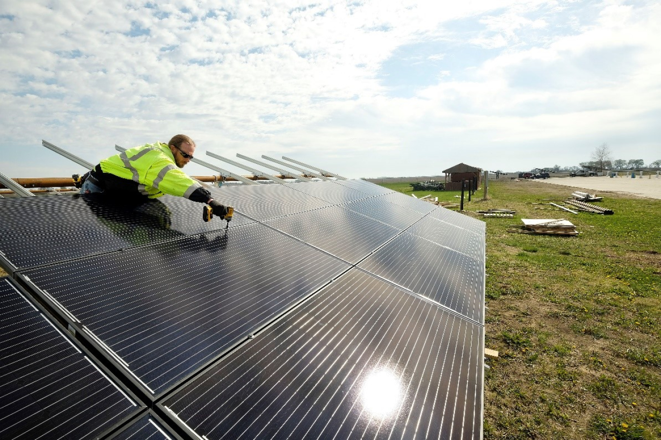 Worker installing solar panels.