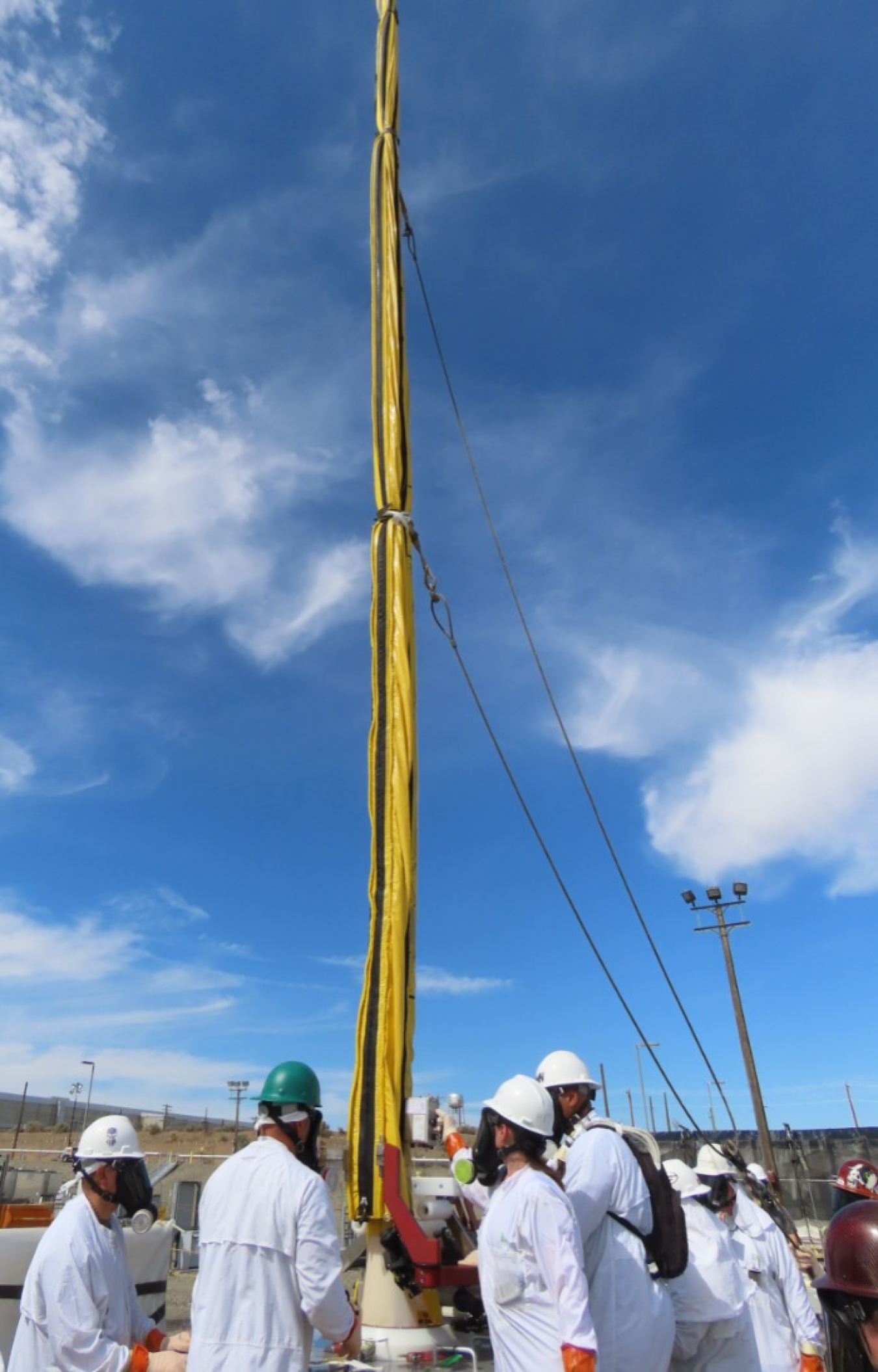 Hanford Site workers remove a waste transfer pump from a double-shell tank, a significant step in ensuring continued safe storage of radioactive and chemical waste.