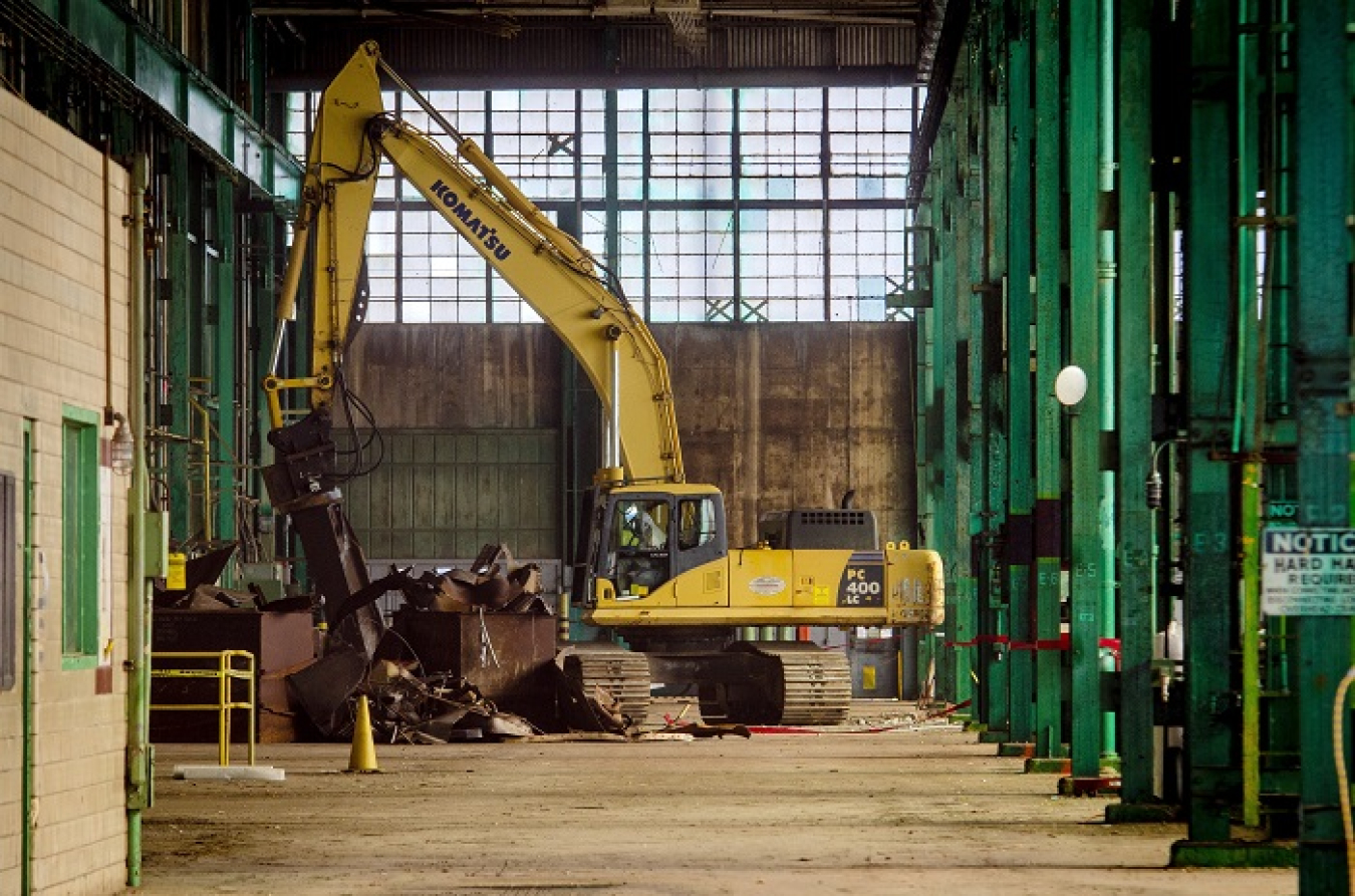Workers removed and downsized dip tanks from the C-400 Cleaning Building as part of deactivation work. Dip tanks were used in the process to clean equipment at the Paducah Site.
