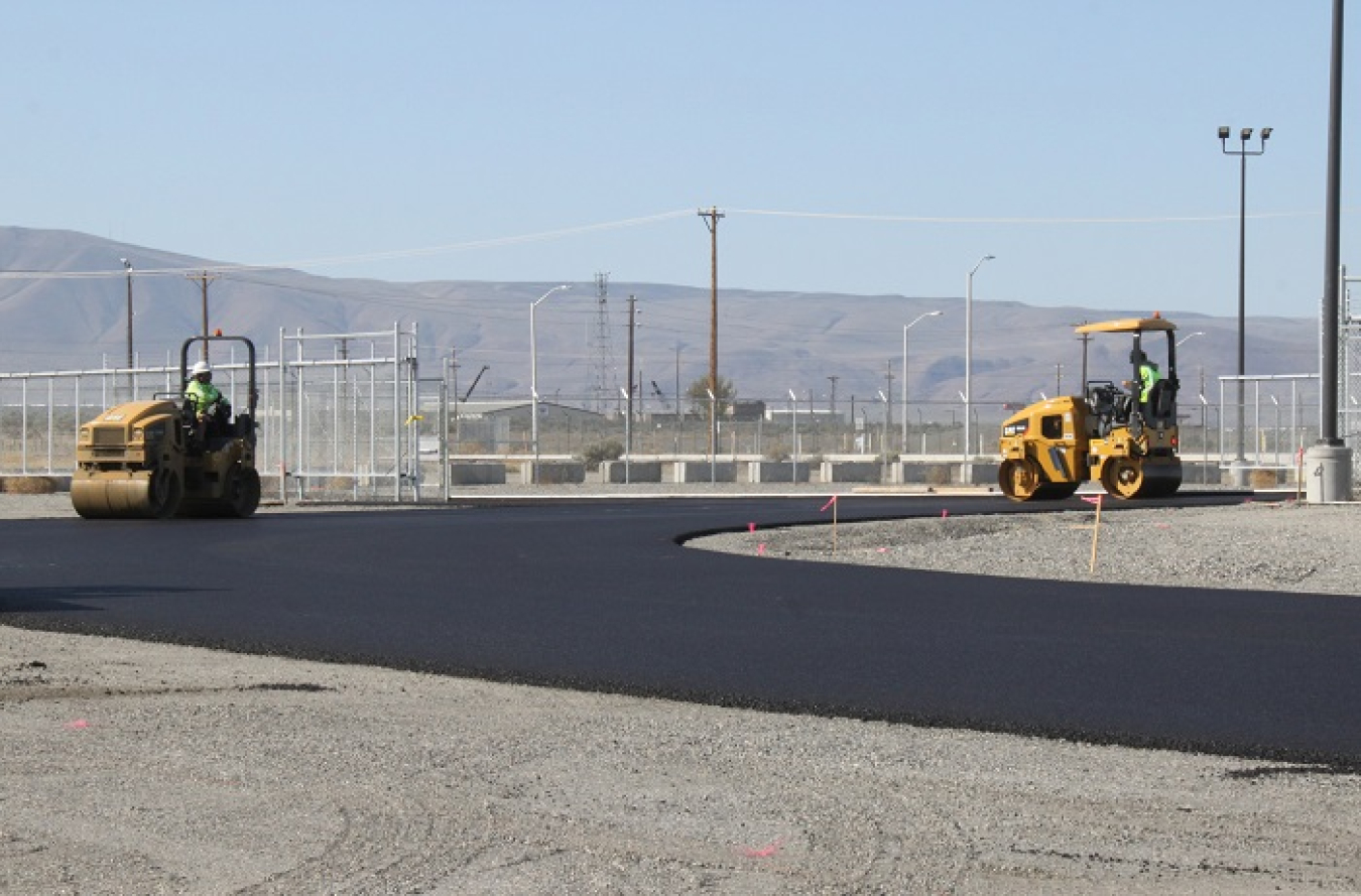 Workers with EM contractor Central Plateau Cleanup Company recently finished paving a new road to support the half-mile transfer of dry-storage casks from the Waste Encapsulation and Storage Facility to a storage pad.